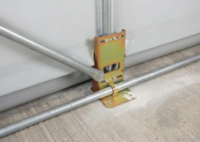 Heavy-duty base fixings securely anchor the TUFFShel Lite to a concrete foundation, ensuring long-term stability in demanding environments.