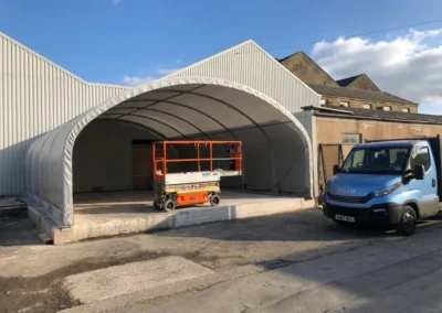 TUFFShel Lite providing covered workspace for an engineering business, creating a practical, weather-protected area for day-to-day operations.