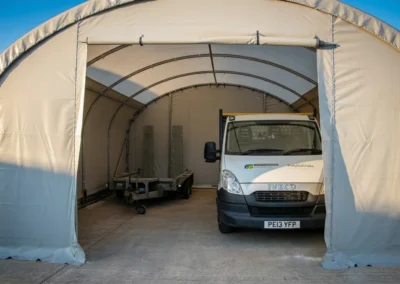 TUFFShel Lite providing secure, weather-protected storage for vehicles and equipment with easy access via roll-up doors.