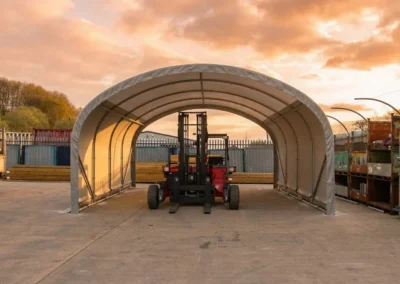 TUFFShel Lite providing covered storage for machinery, with clear access for forklifts and daily yard operations.
