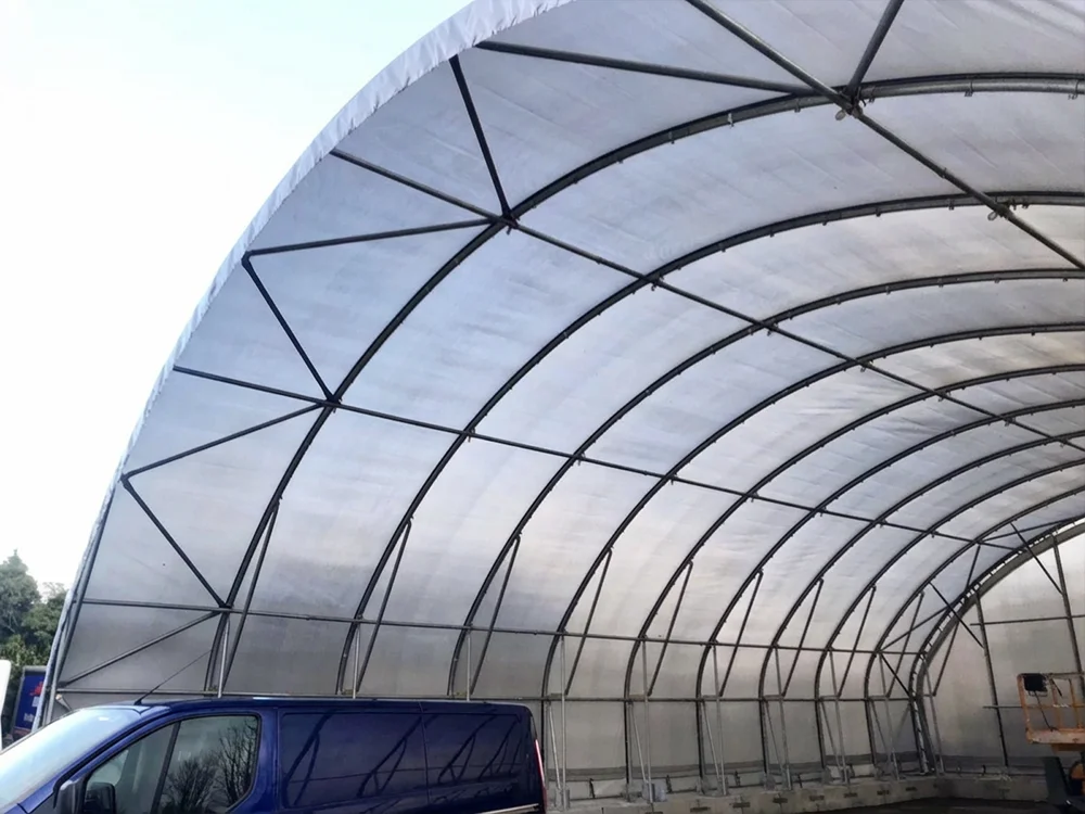 14m wide large span industrial shelter showing clear span steel frame and high internal working space.